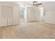 Large carpeted bedroom with two closets and multiple windows for natural light at 7811 Biddstone Ct, Charlotte, NC 28226