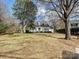 Charming single-story home featuring a well-manicured lawn and mature trees at 7811 Biddstone Ct, Charlotte, NC 28226