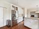 Bright white kitchen featuring stainless steel appliances, custom cabinets, and granite countertops at 7811 Biddstone Ct, Charlotte, NC 28226