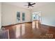 Bright living room with hardwood floors and French doors to a relaxing outdoor space at 7811 Biddstone Ct, Charlotte, NC 28226