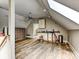 Cozy attic living space, with sleek hardwood floors, offering a unique and versatile room at 7811 Biddstone Ct, Charlotte, NC 28226