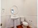Charming powder room with pedestal sink, classic fixtures, and beautiful wood paneling at 7811 Biddstone Ct, Charlotte, NC 28226