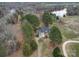 Aerial view of home showcasing mature trees, long driveway, and proximity to water feature at 805 Stack Rd, Monroe, NC 28112