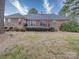 The home's backyard features a well-maintained lawn and mature plantings at 805 Stack Rd, Monroe, NC 28112