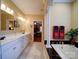 Elegant bathroom with a tub, double sinks, and access to the bedroom at 805 Stack Rd, Monroe, NC 28112