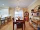 Inviting dining area featuring a chandelier, wood floors, and a view to the kitchen, perfect for Gathering gatherings at 805 Stack Rd, Monroe, NC 28112