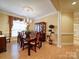 Elegant dining room featuring a chandelier, natural light, and a spacious layout at 805 Stack Rd, Monroe, NC 28112