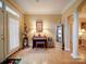 Charming entryway with grand pillars, a sitting area, and lots of natural light at 805 Stack Rd, Monroe, NC 28112