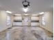 Bright and expansive garage featuring storage cabinets, countertops, and natural light from windows at 805 Stack Rd, Monroe, NC 28112