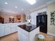 Large kitchen with an island, modern appliances, and view of the dining room and living area at 805 Stack Rd, Monroe, NC 28112