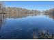 Scenic lake view provides serene backdrop, enhancing property's tranquility and natural beauty at 805 Stack Rd, Monroe, NC 28112