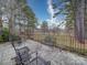 Spacious outdoor patio features comfortable seating and a serene view of the treeline and yard at 805 Stack Rd, Monroe, NC 28112