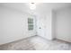 Clean bedroom with large window for natural light, neutral carpet, and a closet at 8455 Old Plank Rd, Charlotte, NC 28216