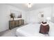 Bright bedroom with neutral colors, dresser, and a comfortable bed, creating a relaxing atmosphere at 8455 Old Plank Rd, Charlotte, NC 28216