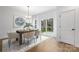 Charming dining room featuring a wooden table, stylish chairs, and a sliding glass door at 8455 Old Plank Rd, Charlotte, NC 28216