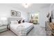 Serene bedroom with neutral tones, comfortable furniture, and plenty of natural light at 8455 Old Plank Rd, Charlotte, NC 28216