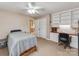 Bedroom features built-in shelving, desk space, and a view to the hallway at 9524 Fairlane Dr, Charlotte, NC 28214