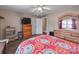 Comfortable bedroom showcasing a colorful bedspread, ceiling fan, and closet at 9524 Fairlane Dr, Charlotte, NC 28214
