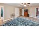 Bedroom featuring neutral walls, carpet flooring, ceiling fan, and dresser at 9524 Fairlane Dr, Charlotte, NC 28214