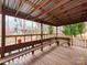 Spacious covered deck offering outdoor seating with a view of the backyard and neighborhood at 9524 Fairlane Dr, Charlotte, NC 28214