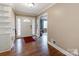 Home entryway with hardwood floors, white trim, and ample natural light at 9524 Fairlane Dr, Charlotte, NC 28214