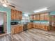 Spacious kitchen featuring new flooring, butcher block counter tops, and modern cabinetry at 9524 Fairlane Dr, Charlotte, NC 28214