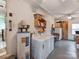 Spacious laundry room with washer, dryer, hot water heater, and storage shelving at 9524 Fairlane Dr, Charlotte, NC 28214