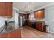 Kitchen with stainless steel appliances, wood cabinets and granite countertops at 1102 Less Traveled Trl, Indian Trail, NC 28079