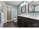 Main bathroom boasts a double vanity, ample storage, and modern finishes and fixtures at 1102 Less Traveled Trl, Indian Trail, NC 28079