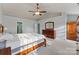 Large main bedroom with vaulted ceiling, neutral carpet, ceiling fan, and ample closet space at 1102 Less Traveled Trl, Indian Trail, NC 28079