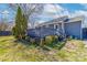 Spacious deck with steps leading to a lush, landscaped backyard and manicured garden at 1205 Poston Cir, Gastonia, NC 28054