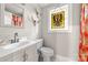 Cozy bathroom with vanity, toilet, and stained glass window for a unique touch at 1205 Poston Cir, Gastonia, NC 28054