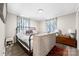 Comfortable bedroom featuring a metal bed frame, wood floors, and vibrant patterned curtains at 1205 Poston Cir, Gastonia, NC 28054