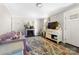 Cozy living room featuring a decorative fireplace, patterned rug, and comfortable seating at 1205 Poston Cir, Gastonia, NC 28054