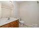 A clean bathroom features a vanity with a sink and a shower-tub combo at 128 Locomotive Ln # 110, Mooresville, NC 28115