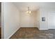 Bright dining area with neutral walls, pendant lighting, and tile flooring at 128 Locomotive Ln # 110, Mooresville, NC 28115