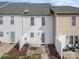 Back view of townhome, with a cozy patio space and privacy fence at 128 Locomotive Ln # 110, Mooresville, NC 28115