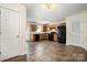 Bright kitchen featuring tile floors, wood cabinets, black appliances, and lots of light at 128 Locomotive Ln # 110, Mooresville, NC 28115