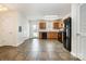 Bright kitchen featuring tile floors, wood cabinets, black appliances, and lots of light at 128 Locomotive Ln # 110, Mooresville, NC 28115