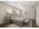 Serene main bedroom boasts neutral tones, soft lighting, and refined decor at 128 Locomotive Ln # 110, Mooresville, NC 28115