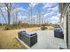 Backyard features an open patio area with seating, a grill, and outdoor space at 14705 Superior St, Charlotte, NC 28273