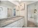 Bathroom features dual sinks with granite countertops and a doorway leading to another room at 14705 Superior St, Charlotte, NC 28273