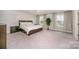 Spacious bedroom featuring a large bed, ample natural light, and elegant decor at 14705 Superior St, Charlotte, NC 28273