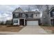 Charming two-story home with a two-car garage, brick and gray siding at 14705 Superior St, Charlotte, NC 28273