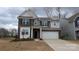 Charming two-story home with a two-car garage and brick and gray siding at 14705 Superior St, Charlotte, NC 28273