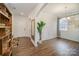 Inviting foyer with hardwood floors, white trim, and a view of the dining area at 14705 Superior St, Charlotte, NC 28273