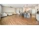 Bright, open-concept living room with wood floors and modern kitchen island at 14705 Superior St, Charlotte, NC 28273