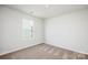 Neutral bedroom with carpet, double-pane window, and two electrical outlets at 1550 Doran Ter, Richburg, SC 29729