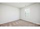 Neutral bedroom with carpeted floor and a bright window at 1568 Doran Ter, Richburg, SC 29729