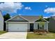 Charming single-story home featuring a two-car garage, light gray siding, and stone accents on the facade at 1568 Doran Ter, Richburg, SC 29729